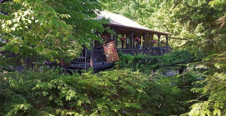 front view of a house with a tree