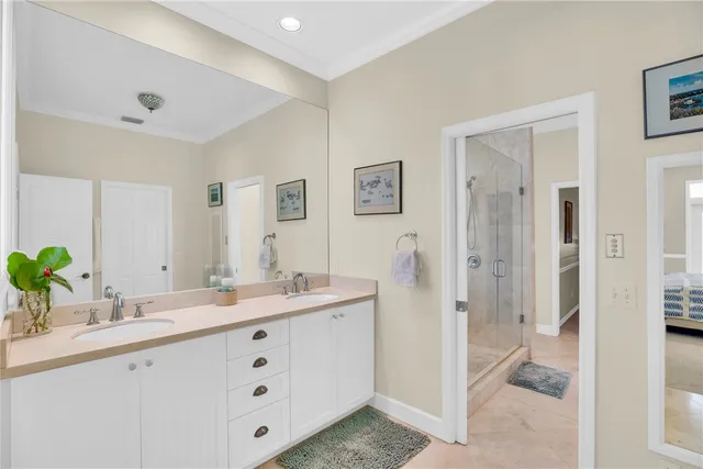 a spacious bathroom with a double vanity sink and a mirror