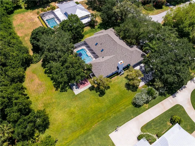 an aerial view of a house with a garden
