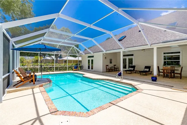a view of a backyard with a patio and a garden