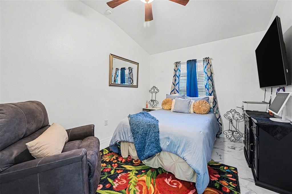 3565 Clay Brick Road Harmony, FL 34773 - Photo 18 of 37 a living room with furniture and a flat screen tv