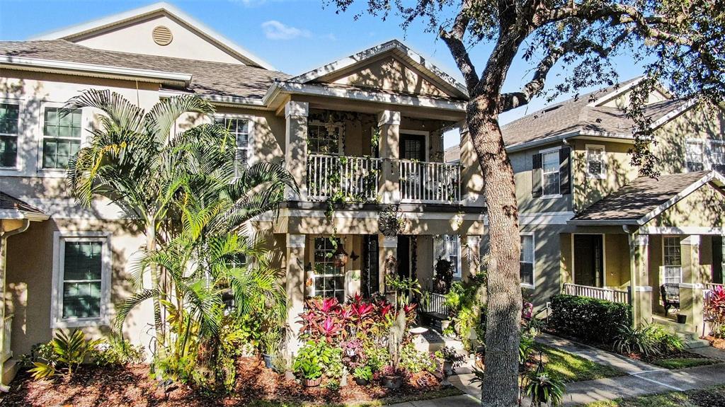 3565 Clay Brick Road Harmony, FL 34773 - Photo 28 of 37 a front view of a house with lots of flowers