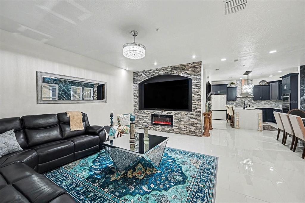 3565 Clay Brick Road Harmony, FL 34773 - Photo 6 of 37 a living room with furniture and a flat screen tv