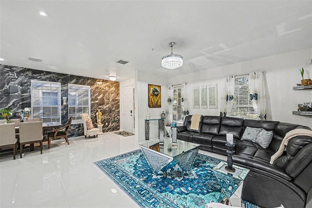 3565 Clay Brick Road Harmony, FL 34773 - Photo 9 of 37 a living room with furniture and a large window