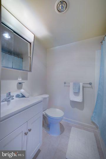1920 North Calvert Street, Unit 2 BR 1 Arlington, VA 22201 - Photo 5 of 9 a bathroom with a sink a toilet and mirror