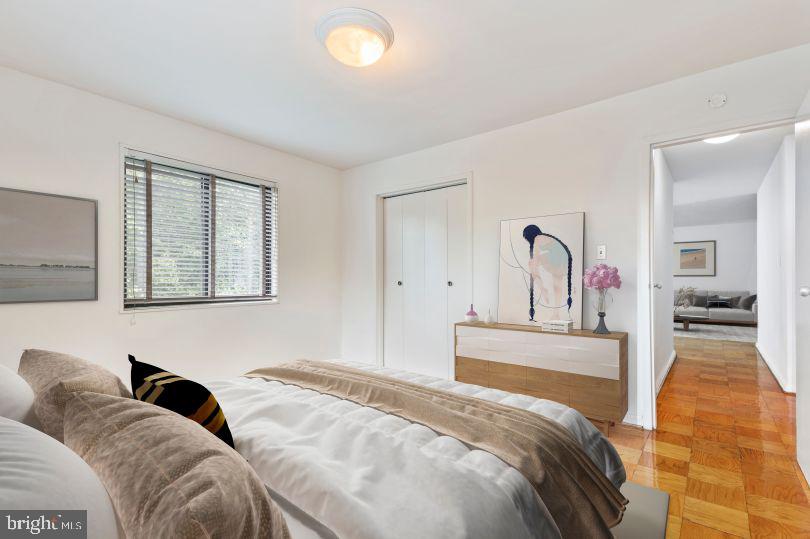 1920 North Calvert Street, Unit 2 BR 1 Arlington, VA 22201 - Photo 6 of 9 a bedroom with a bed and a large mirror