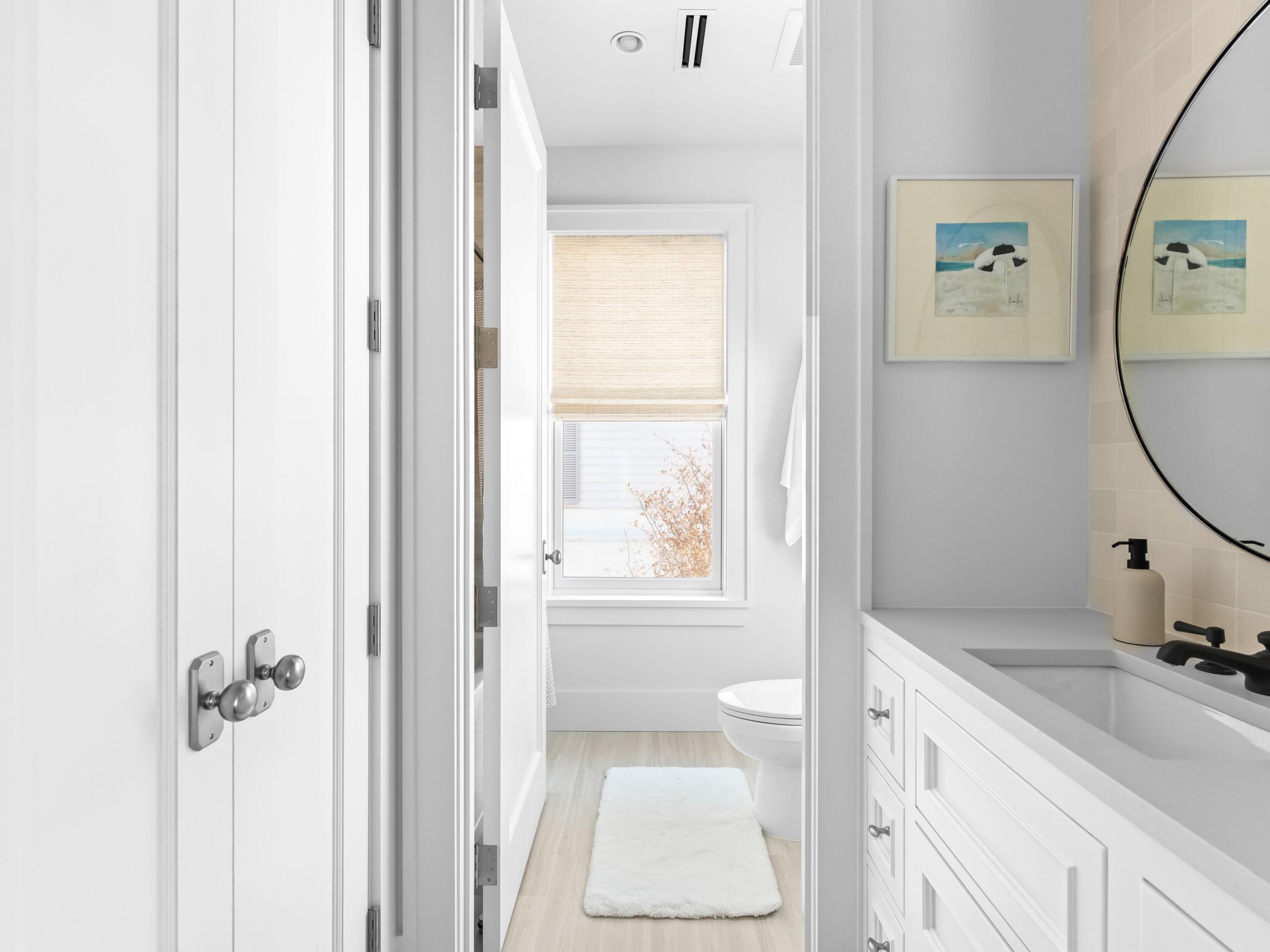 40 Lupin Bch Drive Inlet Beach, FL 32461 - Photo 13 of 35 a bathroom with a sink a toilet and a mirror