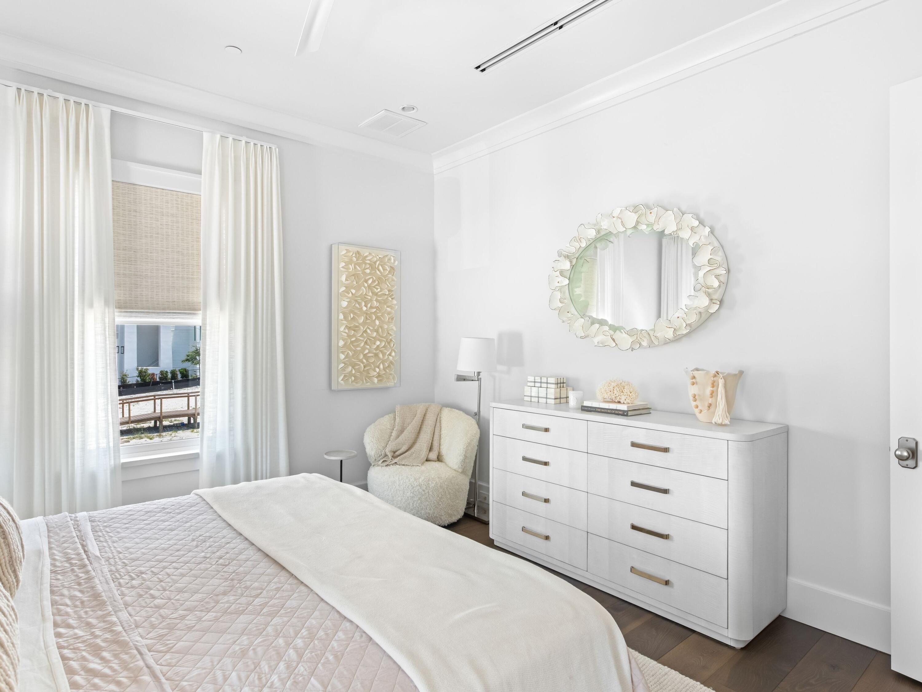 40 Lupin Bch Drive Inlet Beach, FL 32461 - Photo 16 of 35 a bedroom with a bed and a mirror