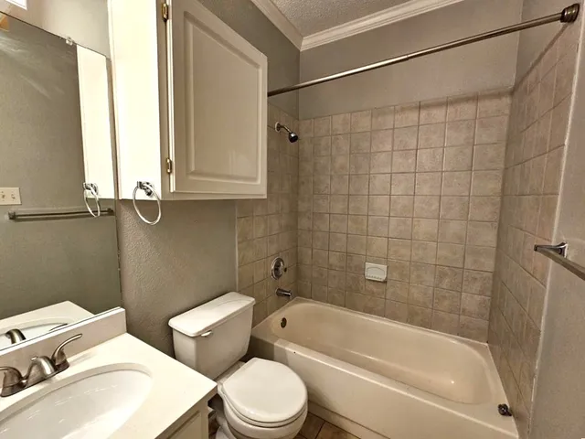 a bathroom with a toilet sink and bathtub