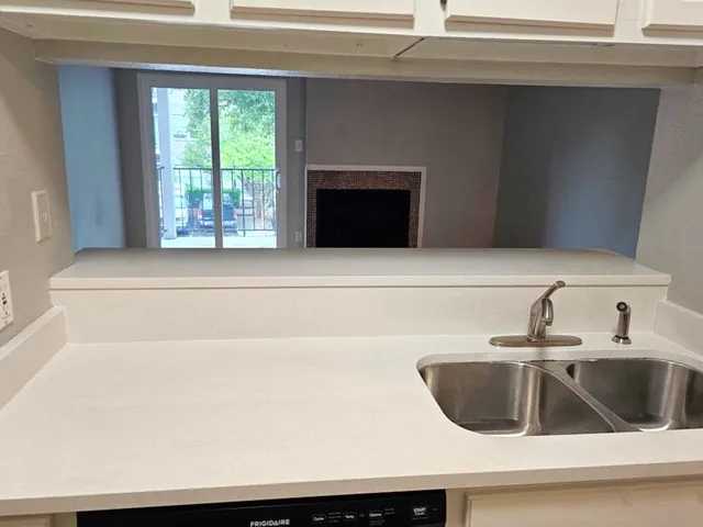 a kitchen with a sink and a microwave
