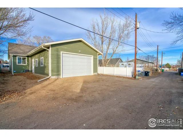 a view of a house with a street