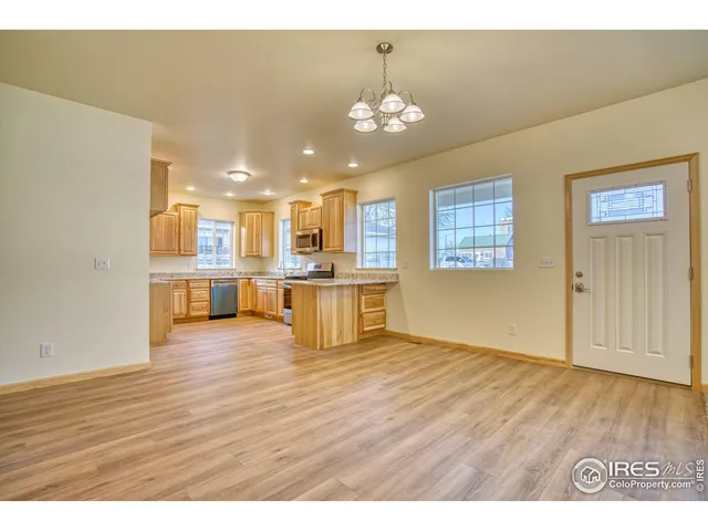 a view of kitchen with cabinets and wooden floor