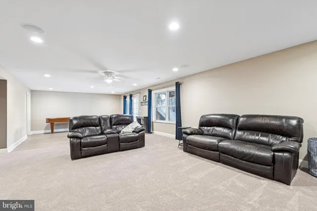a view of dining room with furniture and wooden floor