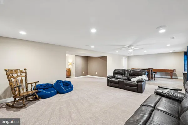 a view of a livingroom with furniture and a window