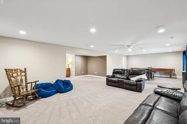 a view of a livingroom with furniture and a window