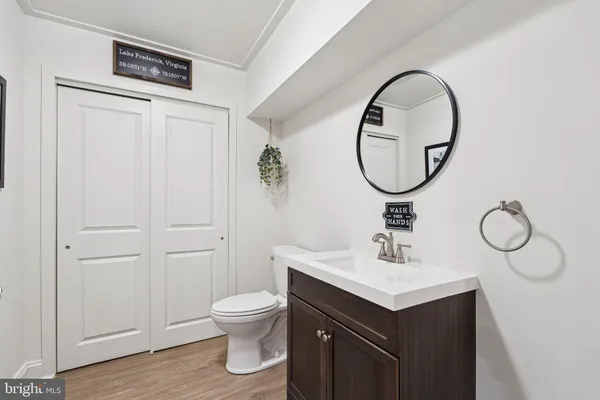 a view of a two chairs and table on the wooden floor