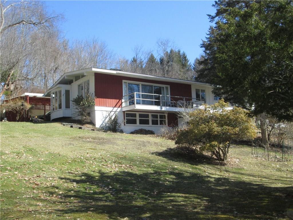 219 Maple Road Mansfield, CT 06268 - Photo 1 of 1 a front view of house with yard and trees in the background
