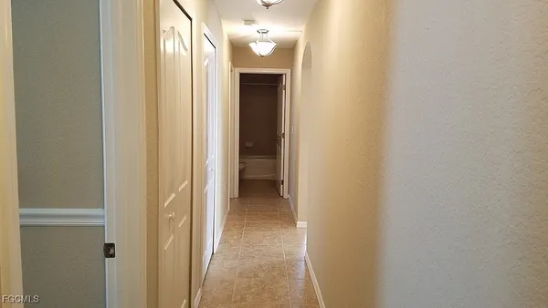 a view of a bathroom from a hallway