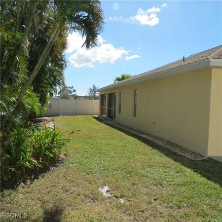 a view of a backyard of the house