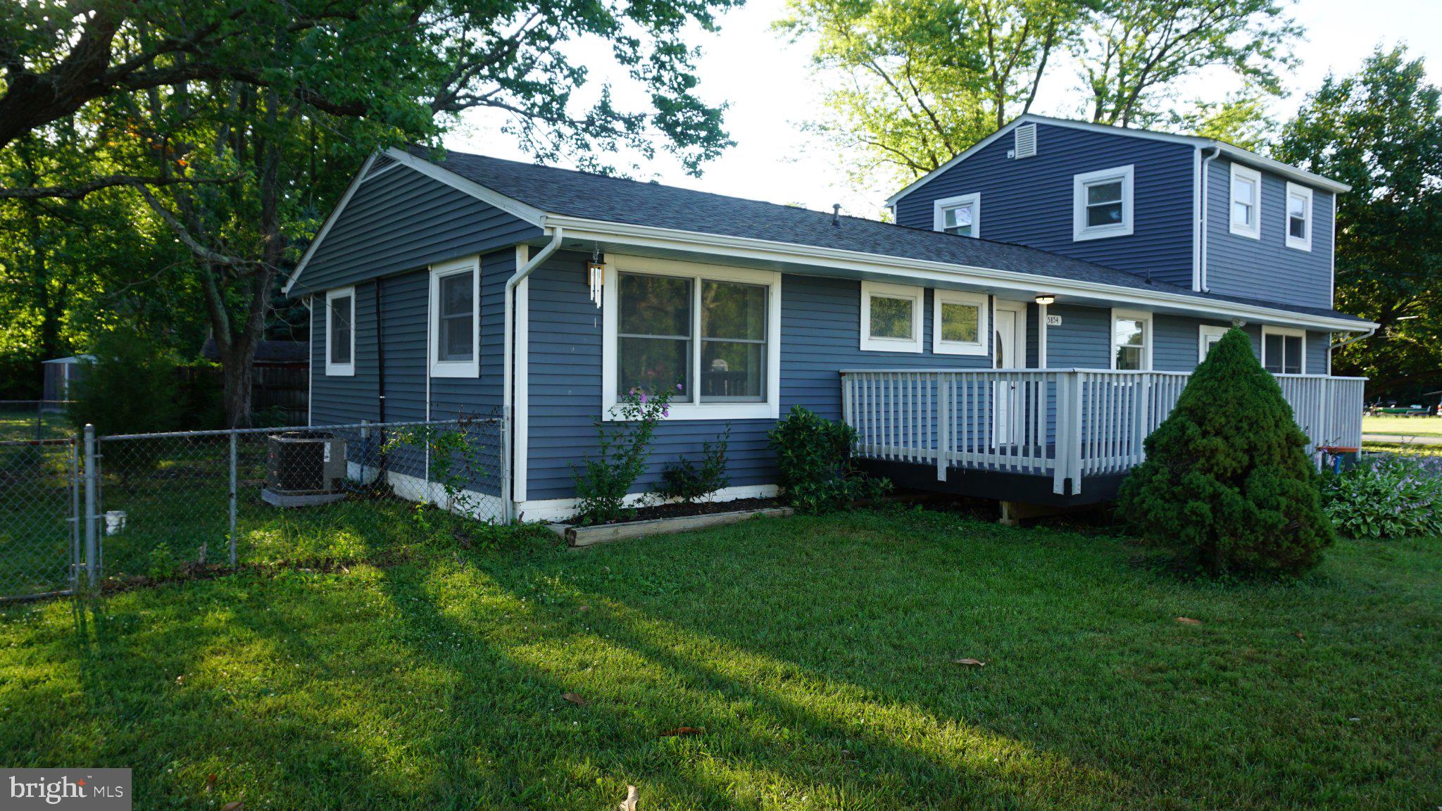 5854 Deale Churchton Road Deale, MD 20751 - Photo 5 of 57 Charming blue home with lush greenery.