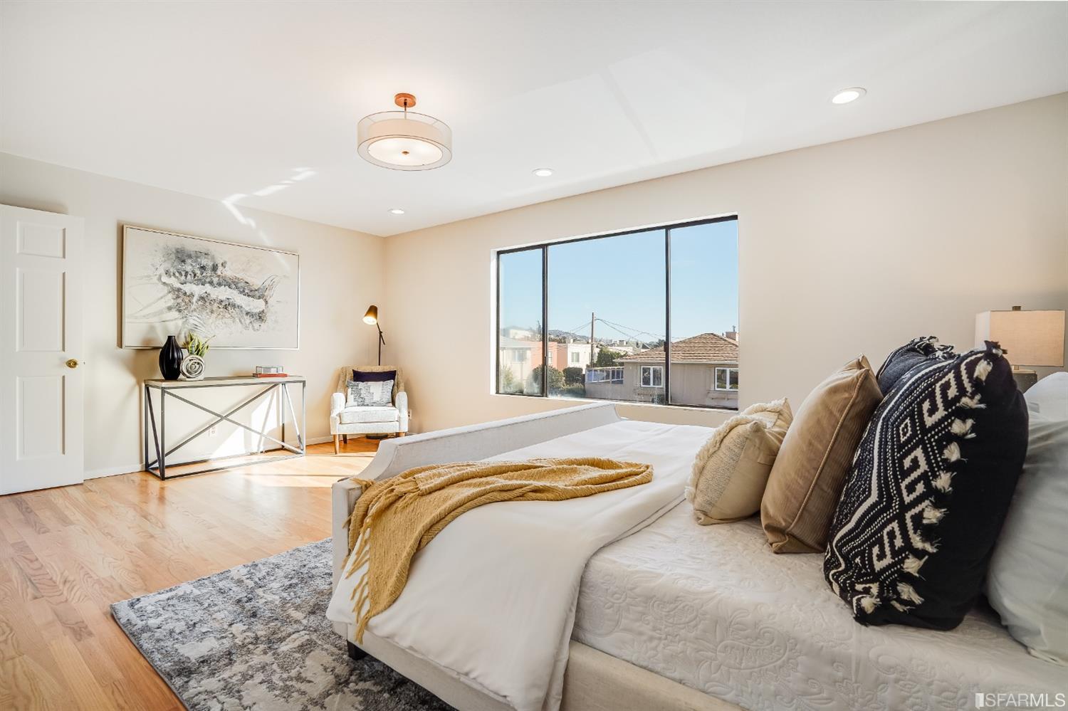 96 Middlefield Drive San Francisco, CA 94132 - Photo 19 of 46 a bedroom with a bed and wooden floor