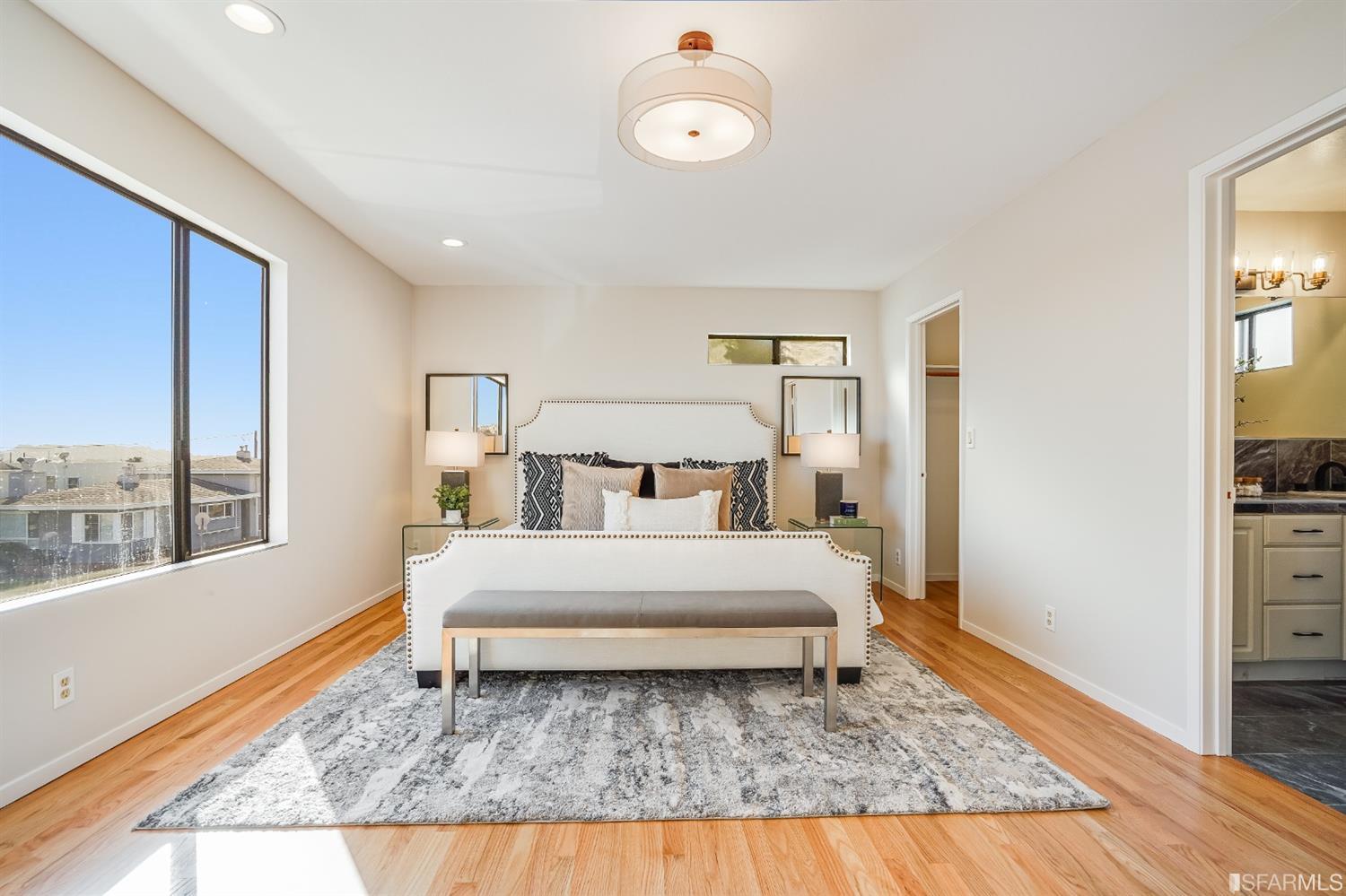 96 Middlefield Drive San Francisco, CA 94132 - Photo 21 of 46 a bed sitting in a bedroom next to a window