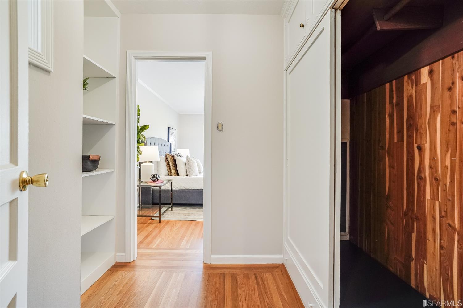 96 Middlefield Drive San Francisco, CA 94132 - Photo 25 of 46 a view of a hallway with wooden floor and a bedroom