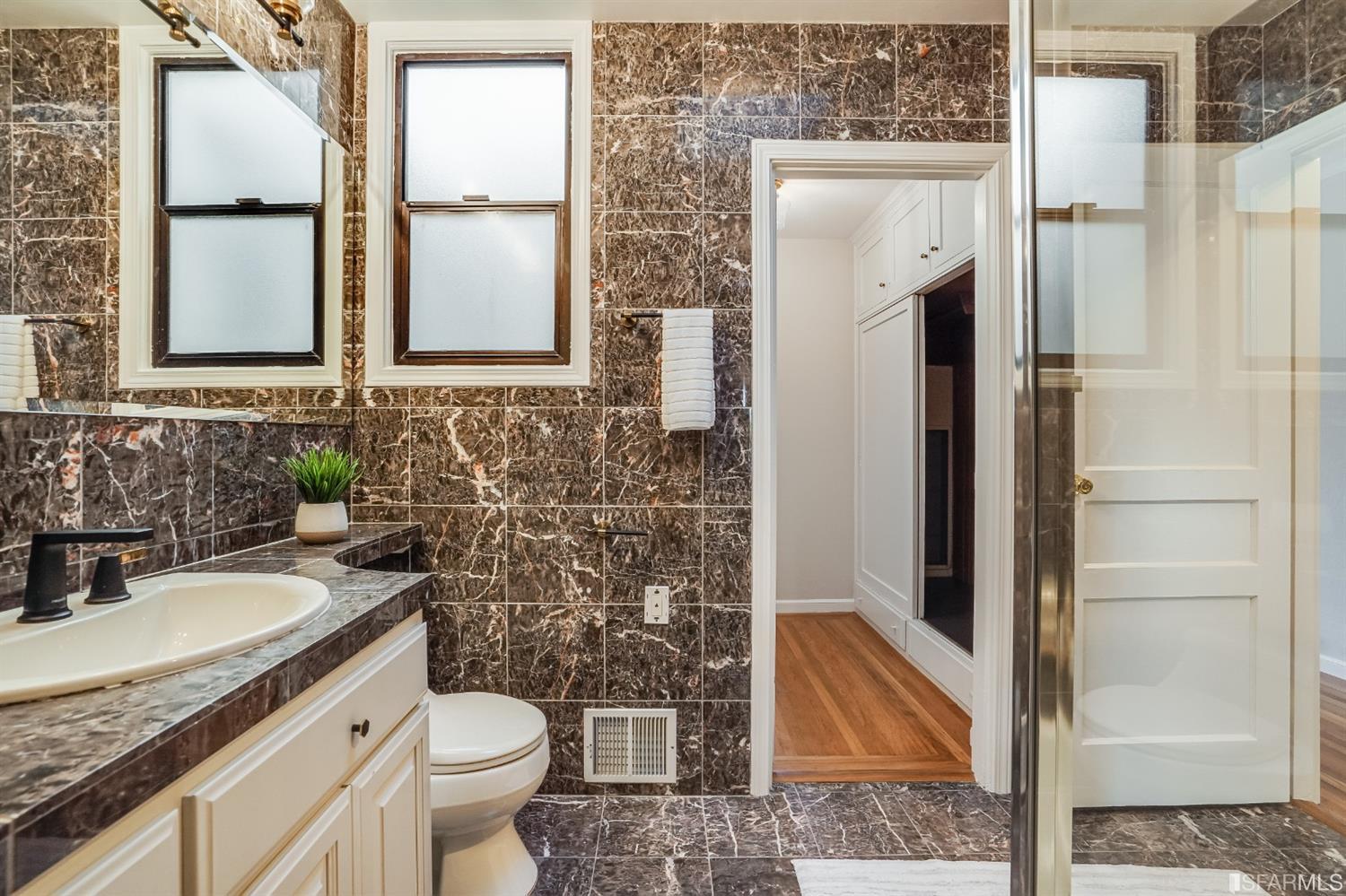 96 Middlefield Drive San Francisco, CA 94132 - Photo 28 of 46 a bathroom with a granite countertop sink toilet and shower