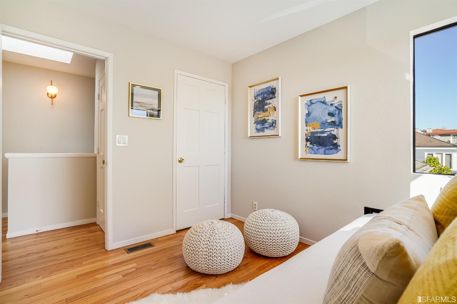 96 Middlefield Drive San Francisco, CA 94132 - Photo 33 of 46 a bedroom with a bed and a couch