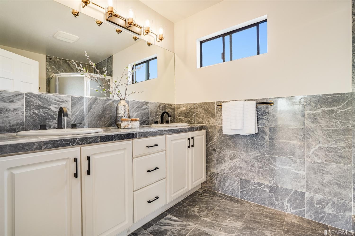 96 Middlefield Drive San Francisco, CA 94132 - Photo 34 of 46 a bathroom with a sink and mirror