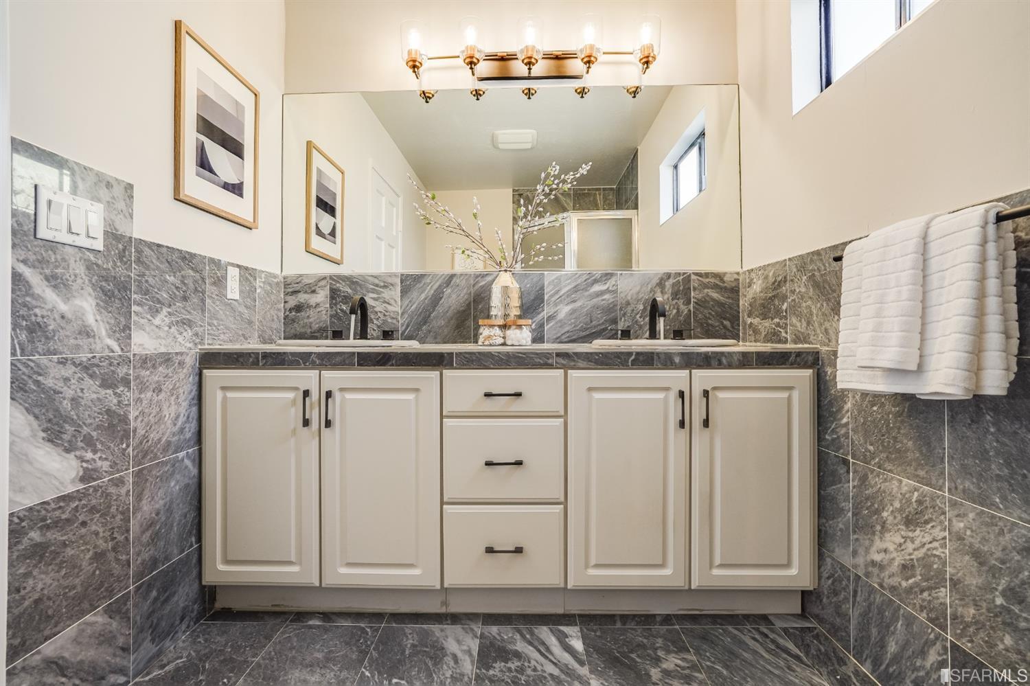 96 Middlefield Drive San Francisco, CA 94132 - Photo 35 of 46 a bathroom with a granite countertop sink and a mirror