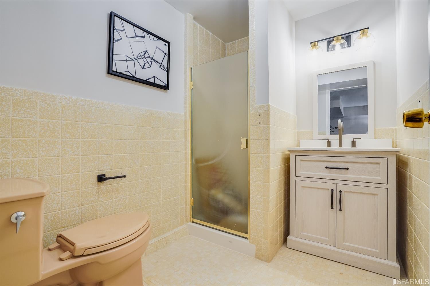 96 Middlefield Drive San Francisco, CA 94132 - Photo 38 of 46 a bathroom with a granite countertop toilet sink and mirror