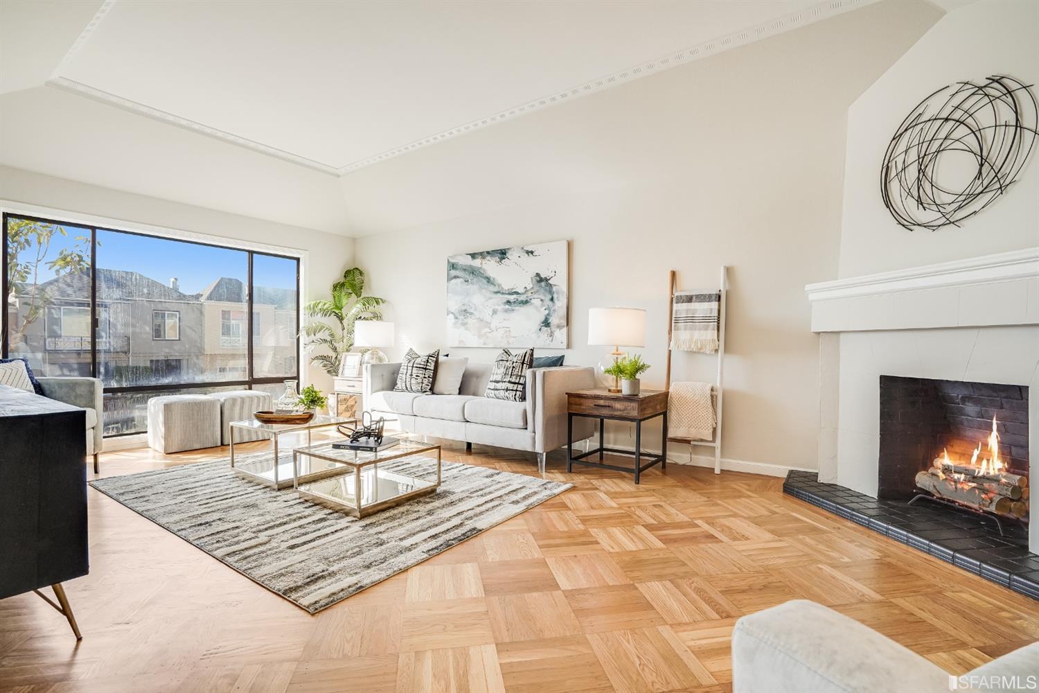 96 Middlefield Drive San Francisco, CA 94132 - Photo 9 of 46 a living room with furniture a fireplace and a table