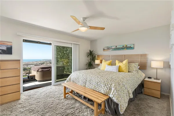 a bedroom with a bed couch and window