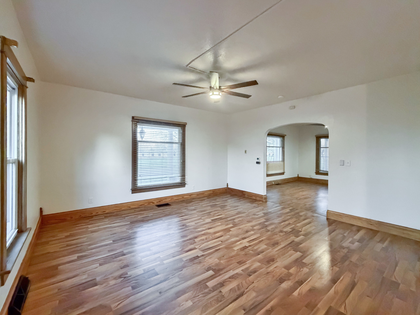 310 1st Avenue Forreston, IL 61030 - Photo 11 of 33 a view of empty room with wooden floor and fan