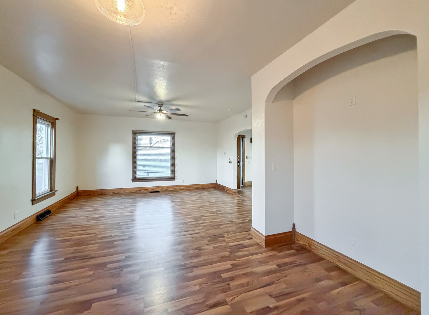 310 1st Avenue Forreston, IL 61030 - Photo 12 of 33 a view of empty room with wooden floor and fan