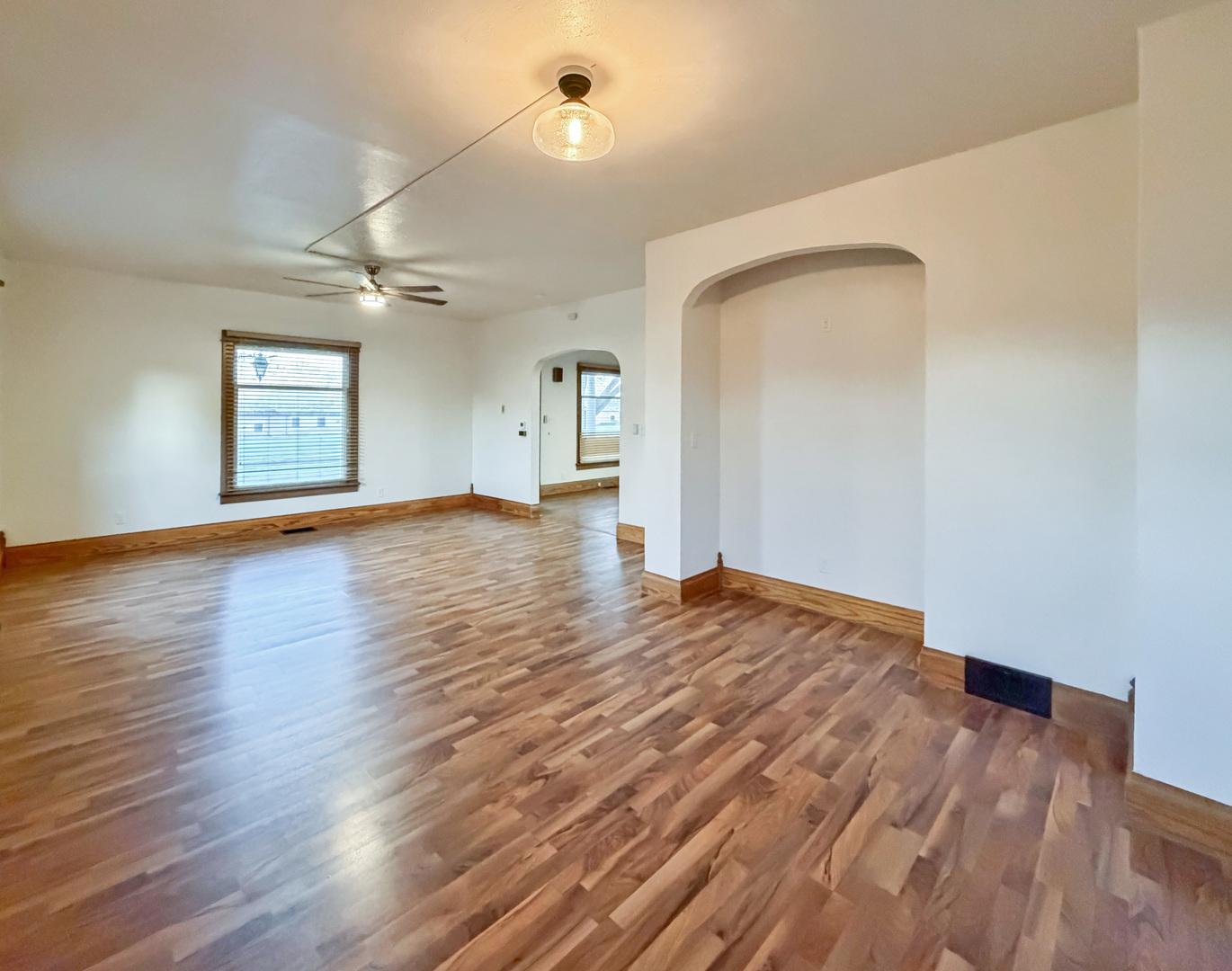 310 1st Avenue Forreston, IL 61030 - Photo 13 of 33 a view of an empty room with window and wooden floor