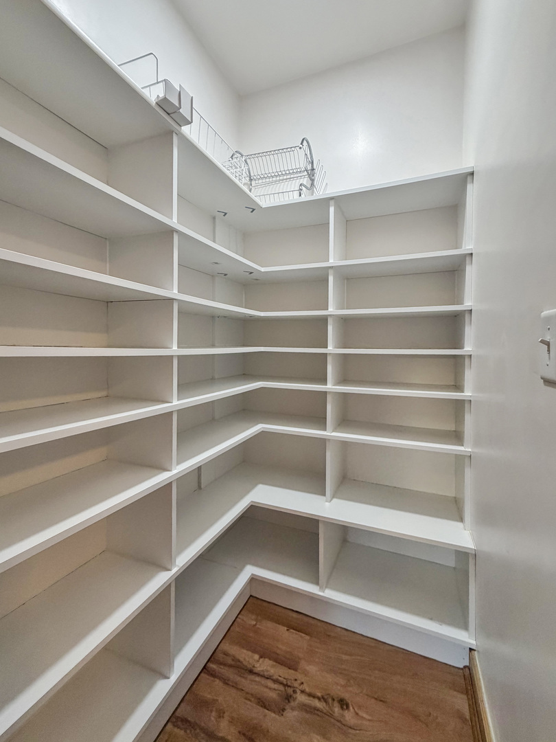310 1st Avenue Forreston, IL 61030 - Photo 18 of 33 a view of walk in closet with empty racks