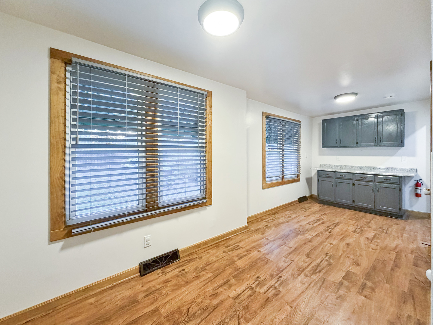 310 1st Avenue Forreston, IL 61030 - Photo 19 of 33 a view of an empty room with window and kitchen view