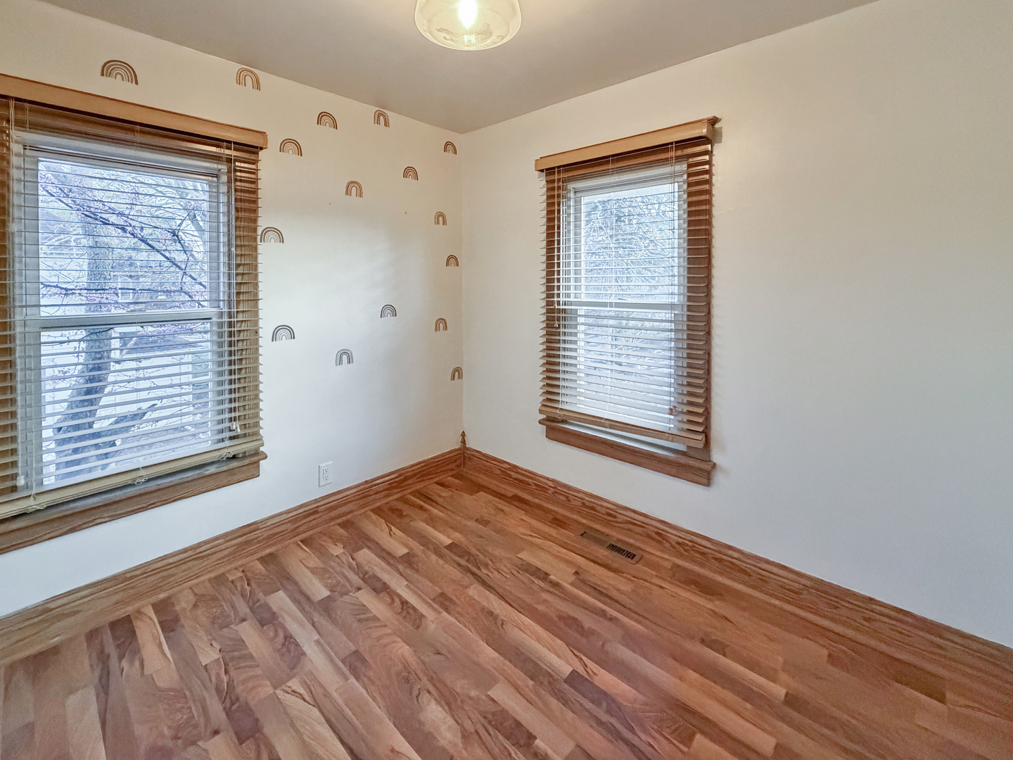 310 1st Avenue Forreston, IL 61030 - Photo 20 of 33 a view of an empty room with wooden floor and a window