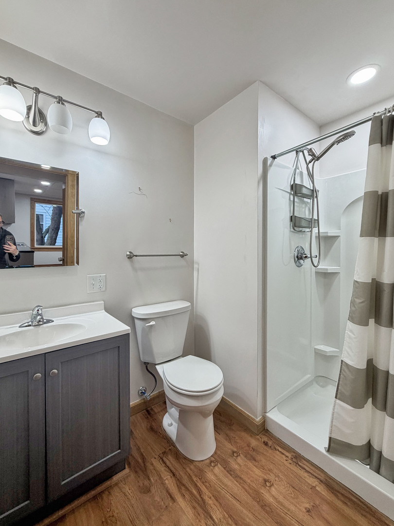 310 1st Avenue Forreston, IL 61030 - Photo 21 of 33 a bathroom with a sink toilet and shower