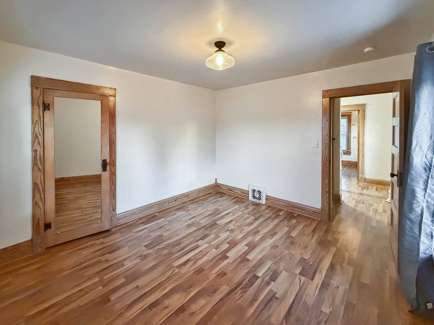 310 1st Avenue Forreston, IL 61030 - Photo 24 of 33 wooden floor in an empty room with a window