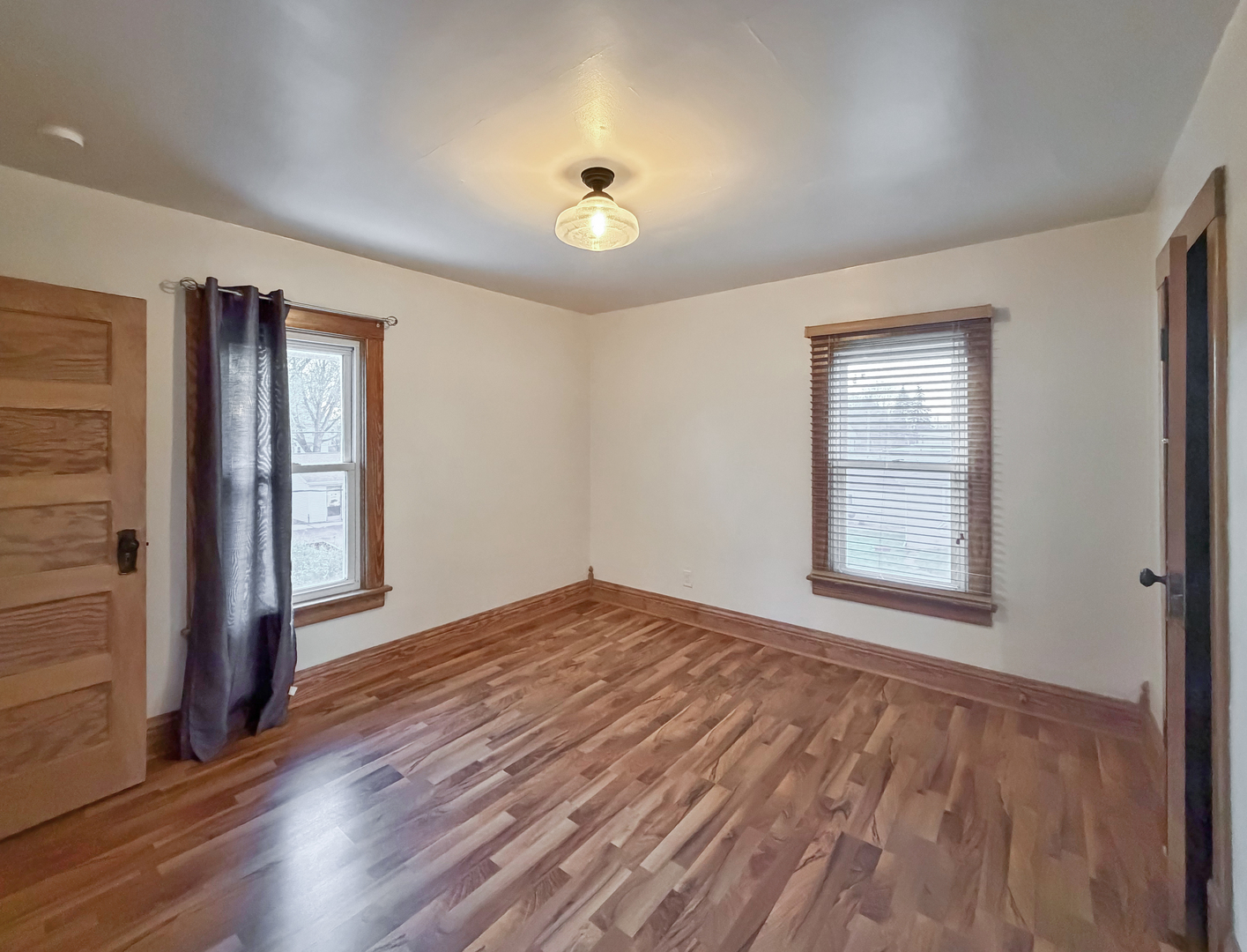 310 1st Avenue Forreston, IL 61030 - Photo 25 of 33 a view of an empty room with window and wooden floor