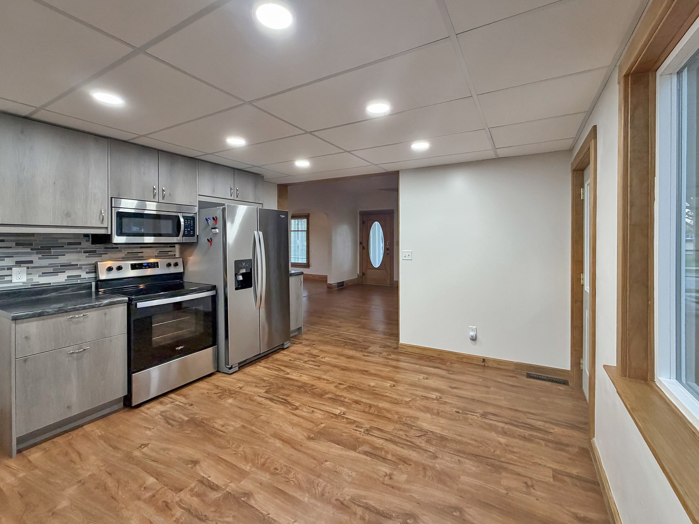 310 1st Avenue Forreston, IL 61030 - Photo 3 of 33 a view of kitchen with refrigerator and microwave