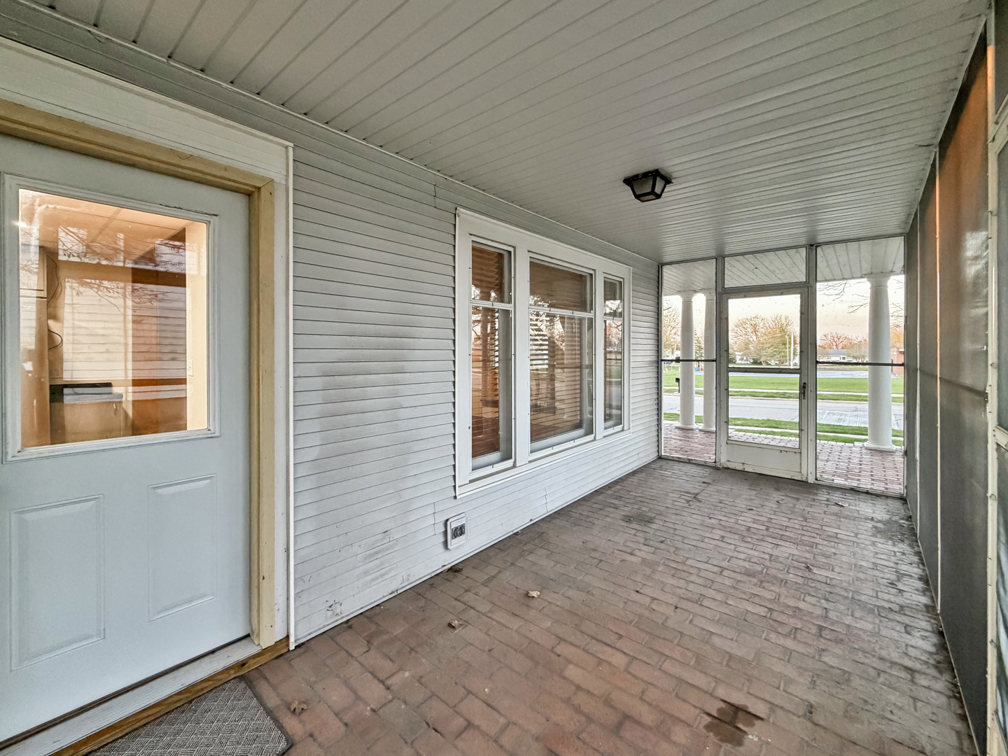 310 1st Avenue Forreston, IL 61030 - Photo 31 of 33 a view of empty room with floor to ceiling window and wooden floor
