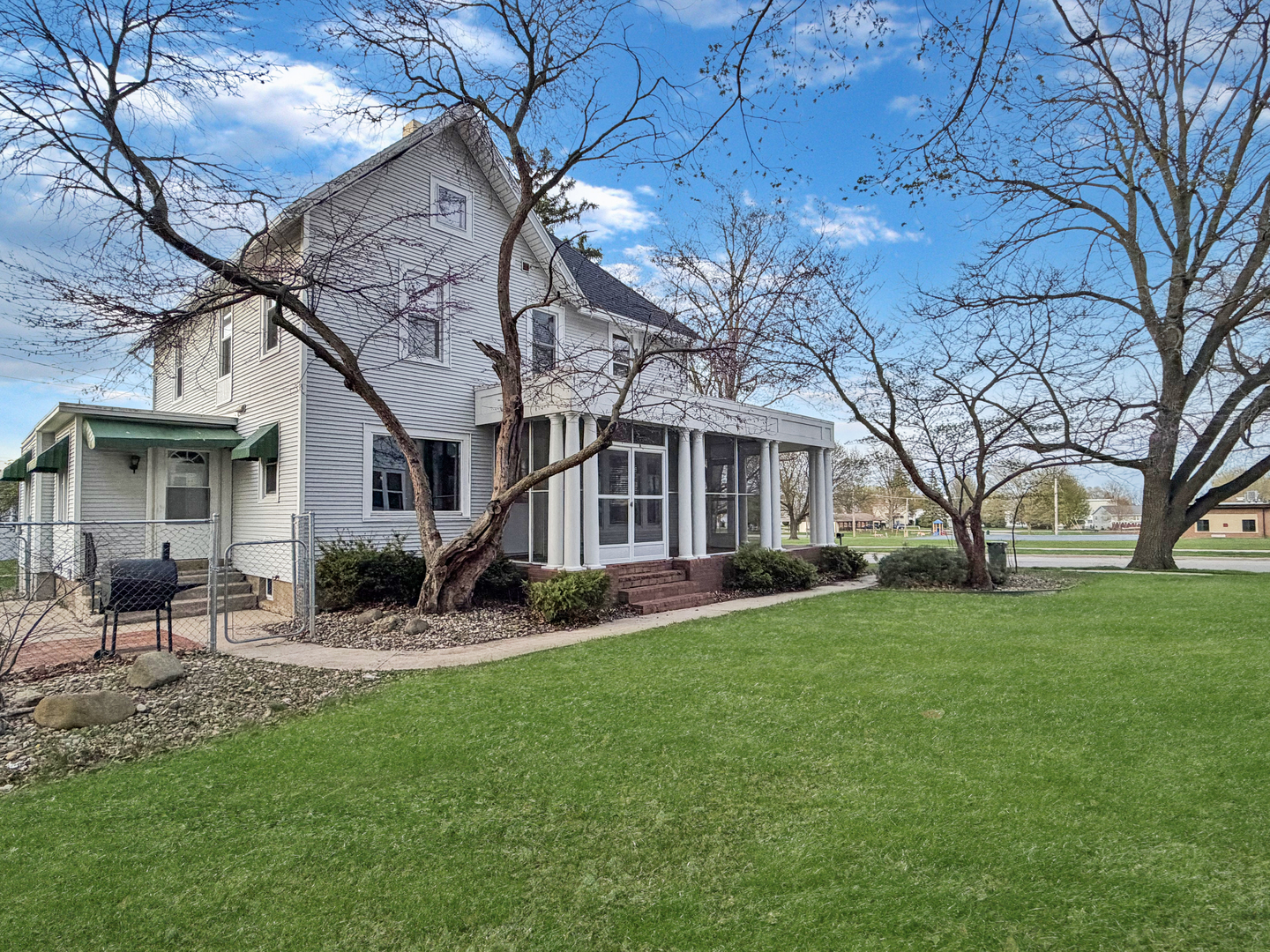 310 1st Avenue Forreston, IL 61030 - Photo 33 of 33 a front view of a house with garden and trees