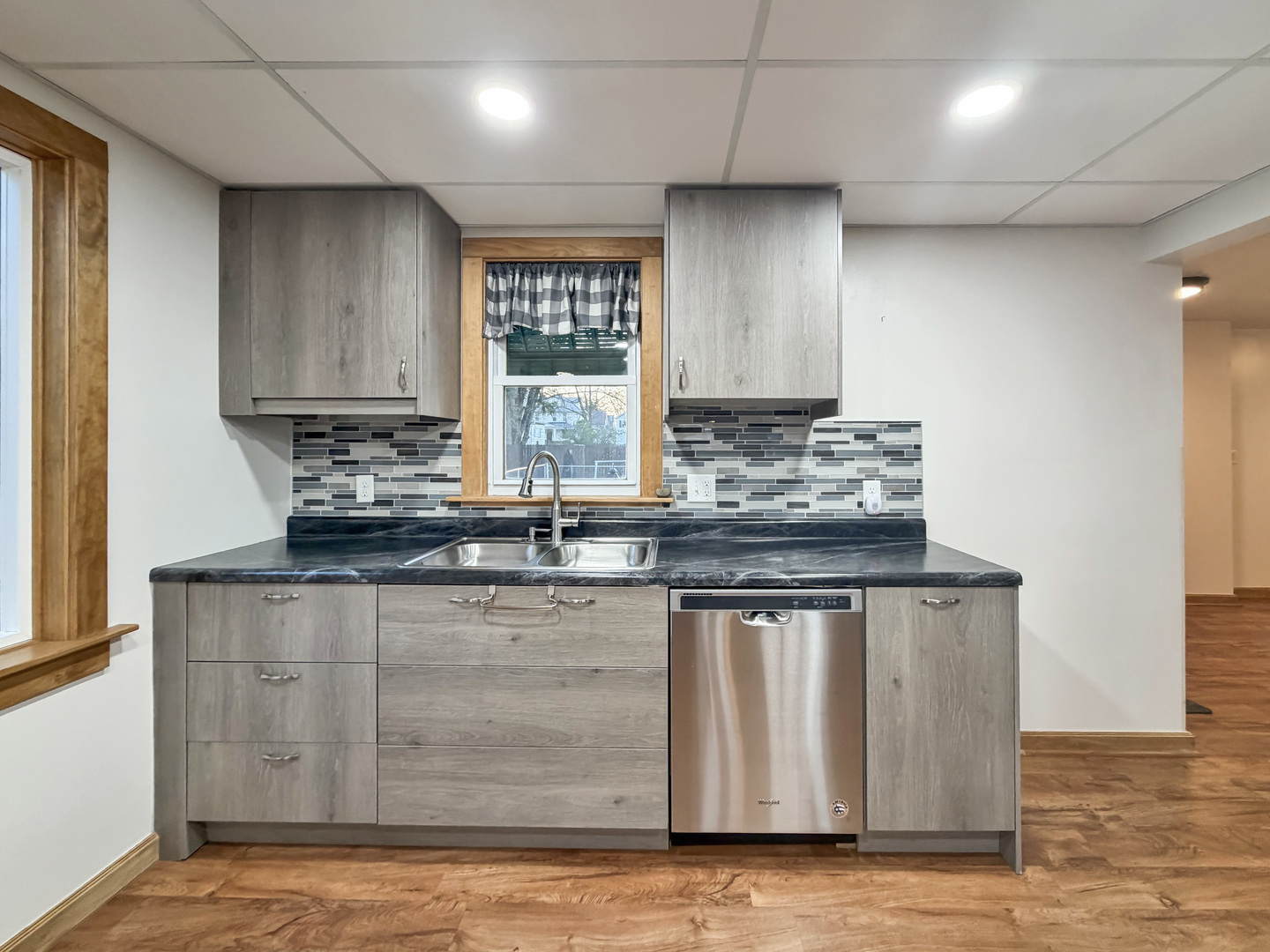 310 1st Avenue Forreston, IL 61030 - Photo 4 of 33 a kitchen with stainless steel appliances granite countertop a sink stove and cabinets