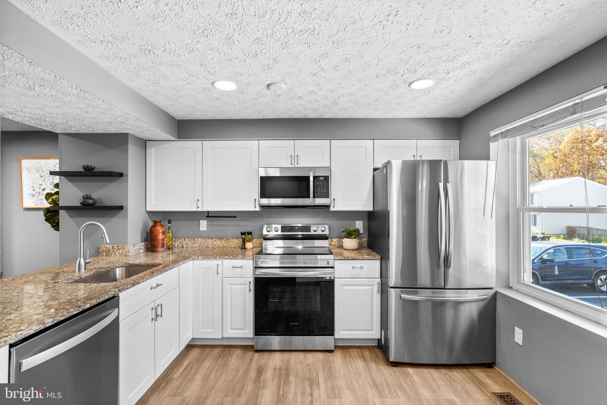 8433 Sugar Creek Lane Springfield, VA 22153 - Photo 12 of 47 Modern kitchen with sleek finishes.