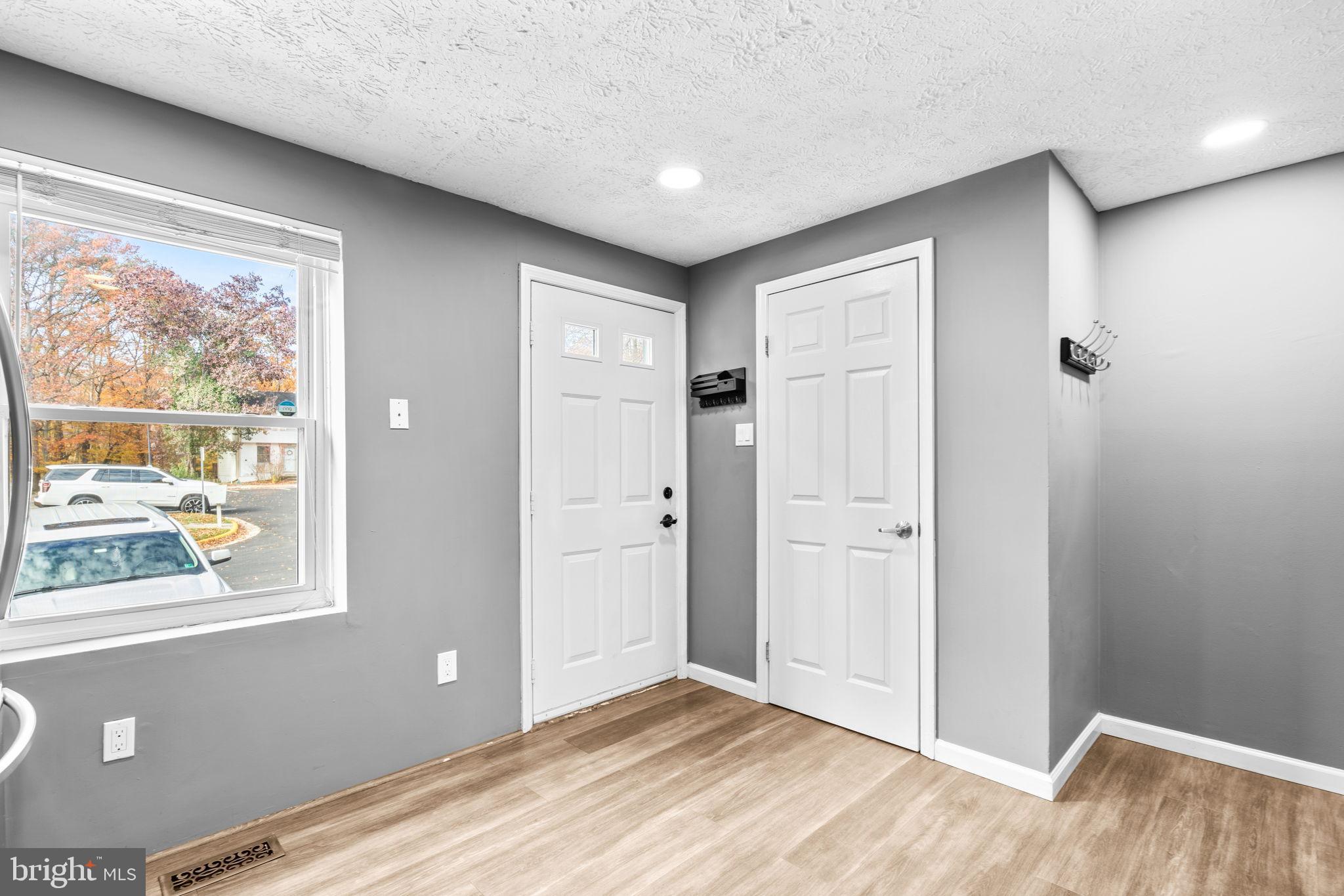 8433 Sugar Creek Lane Springfield, VA 22153 - Photo 15 of 47 Bright and inviting entryway with modern charm.