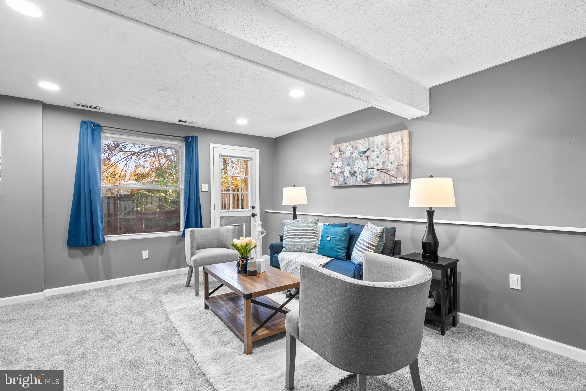 8433 Sugar Creek Lane Springfield, VA 22153 - Photo 32 of 47 Cozy basement living space with modern charm.